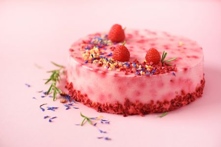 pink marble cake with raspberries dry flowers rosemary copy space for your text
